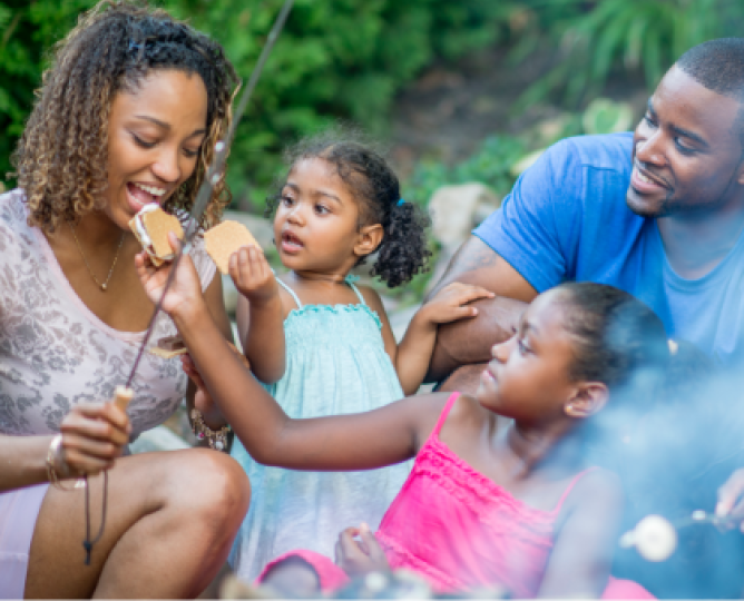 Family eating S'mores